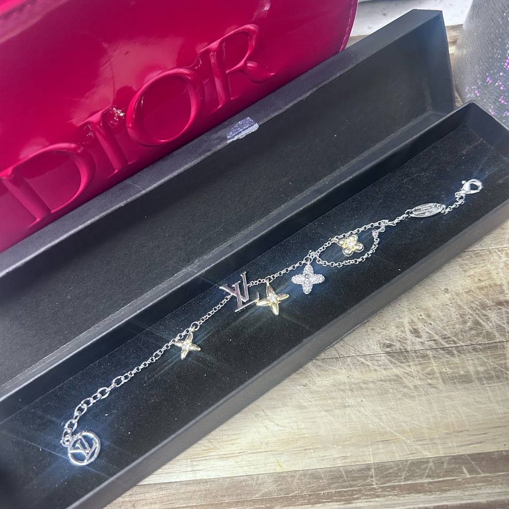 Louis Vuitton two- tone Silver Bracelet with Gold and Silver Charms